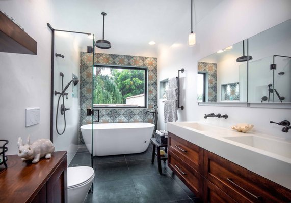 Spa Bathroom - We gutted this bathroom and rebuilt it from top to bottom. This Spanish home was built in 1929 and our design compliments it's original Spanish architecture. We provided the client with a barrier free shower, beautiful water works and hardware, a free standing spa bath & soaking tub, recess lighting, built-in niches, wall mount vanity, wall mount toilet and custom millwork throughout. Spa Bathroom - We gutted this bathroom and rebuilt it from top to bottom. This Spanish home was built in 1929 and our design compliments it's original Spanish architecture. We provided the client with a barrier free shower, beautiful water works and hardware, a free standing spa bath & soaking tub, recess lighting, built-in niches, wall mount vanity, wall mount toilet and custom millwork throughout.