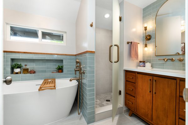 Carlsbad Master Bathroom Remodel - Serenity and Luxury: A Master Bathroom Remodel with a Freestanding Tub in Carlsbad, California"

Introduction:
Carlsbad, a coastal gem in California, is known for its pristine beaches and idyllic living. Recently, a master bathroom remodel in this beautiful city has taken the concept of relaxation and luxury to new heights, all centered around a stunning freestanding bathtub. In this post, we will immerse ourselves in the journey of transforming a master bathroom into a serene oasis that brings the charm of Carlsbad right into your daily routine.

The Beginning:
The master bathroom in this Carlsbad residence was, by all means, functional, but it lacked the essence of tranquility and elegance. The homeowners sought to create a space where they could escape the daily hustle and bustle, and the focal point of their vision was a luxurious freestanding bathtub.

Ocean-Inspired Design:
Inspired by the coastal beauty of Carlsbad, the design of the bathroom incorporated a palette of serene blues and soft whites. The choice of colors, along with the addition of natural materials like marble and wood, brought the soothing essence of the ocean into the space.

Spacious Layout:
The bathroom's layout was optimized for a more spacious feel. By removing an unnecessary wall and replacing the old fixtures, the space opened up to allow the freestanding bathtub to become a central feature, offering views of the stunning Carlsbad landscape.

The Freestanding Tub:
The star of the show was undeniably the freestanding tub. It was positioned near large windows that offered a view of the outdoors, and the homeowners could now indulge in a relaxing soak while being immersed in the beauty of Carlsbad's natural surroundings.

Luxurious Materials:
The choice of materials was pivotal in creating a sense of luxury. Marble was used for the countertops, shower walls, and flooring, adding a touch of timeless elegance to the space. Wood accents, including custom cabinetry and a vanity, added warmth and natural beauty.

Walk-In Shower:
The remodel included a spacious, walk-in shower with a rain showerhead and glass enclosure. The addition of body jets and a built-in bench turned the shower into a spa-like retreat, ensuring that every aspect of the master bathroom was designed for relaxation.

Ample Storage:
Custom cabinetry provided plenty of storage space, ensuring that the bathroom remained organized and clutter-free. With designated storage for towels, toiletries, and linens, the space was as practical as it was beautiful.

Designer Lighting:
A combination of natural light from the windows and designer lighting fixtures completed the look. Chandeliers and sconces added a touch of opulence to the master bathroom and created a serene ambiance.

Conclusion:
The Carlsbad master bathroom remodel with a freestanding tub is a testament to the power of thoughtful design and luxury. It effortlessly blends the essence of Carlsbad's coastal beauty with timeless elegance, creating a sanctuary of relaxation. If you're considering a master bathroom remodel in Carlsbad, take inspiration from this project, and you'll be well on your way to enjoying the tranquility and luxury of this coastal paradise right in the heart of your home.