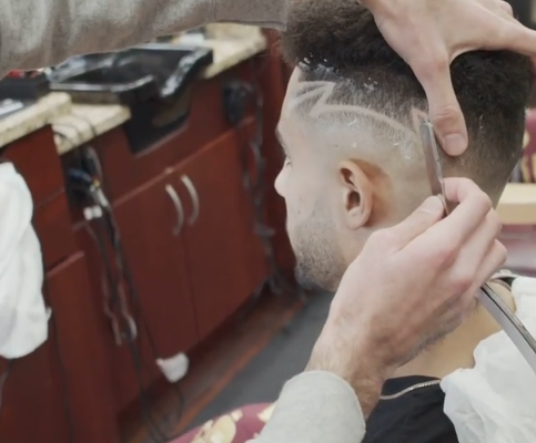 Fade + Design - Skin fade with a design and straight razor touch ups