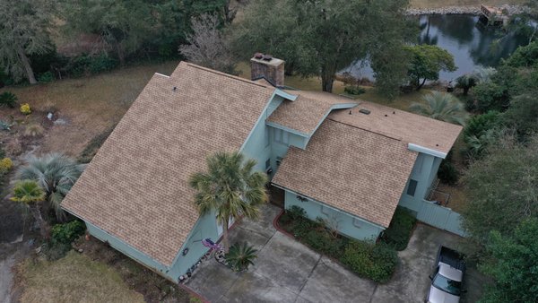 North Myrtle Beach Roof Replacement: Complete Tear Off and New Shingle Installation - This North Myrtle Beach homeowner reached out to us after years of wear finally caught up with their roof. Cracked and curling shingles, granule loss, and a few soft spots on the deck were signs it was time for a full replacement, not another patch job.
Our team started with a complete tear off, stripping the roof down to the decking so we could properly inspect for any hidden damage from years of coastal sun, wind, and rain. A few sections of decking needed to be replaced before we moved forward, ensuring the new roof would have a solid foundation underneath it.
From there, our crew installed a fresh layer of synthetic underlayment for added protection against moisture, followed by new architectural shingles chosen to stand up to the salt air and storm season this close to the coast. Every detail was handled with precision, from proper flashing around vents and valleys to clean, straight shingle lines across the entire roofline.
The difference between the before and after is dramatic. What was once a tired, aging roof showing its age is now a clean, modern roofline that boosts curb appeal and, more importantly, gives this family real peace of mind heading into hurricane season.
This is the kind of transformation we love being part of. A stronger roof, a better looking home, and homeowners who can rest easy knowing their house is protected. Proud of this one, Linta Roofing crew. Another North Myrtle Beach home taken care of the right way. North Myrtle Beach Roof Replacement: Complete Tear Off and New Shingle Installation - This North Myrtle Beach homeowner reached out to us after years of wear finally caught up with their roof. Cracked and curling shingles, granule loss, and a few soft spots on the deck were signs it was time for a full replacement, not another patch job.
Our team started with a complete tear off, stripping the roof down to the decking so we could properly inspect for any hidden damage from years of coastal sun, wind, and rain. A few sections of decking needed to be replaced before we moved forward, ensuring the new roof would have a solid foundation underneath it.
From there, our crew installed a fresh layer of synthetic underlayment for added protection against moisture, followed by new architectural shingles chosen to stand up to the salt air and storm season this close to the coast. Every detail was handled with precision, from proper flashing around vents and valleys to clean, straight shingle lines across the entire roofline.
The difference between the before and after is dramatic. What was once a tired, aging roof showing its age is now a clean, modern roofline that boosts curb appeal and, more importantly, gives this family real peace of mind heading into hurricane season.
This is the kind of transformation we love being part of. A stronger roof, a better looking home, and homeowners who can rest easy knowing their house is protected. Proud of this one, Linta Roofing crew. Another North Myrtle Beach home taken care of the right way.
