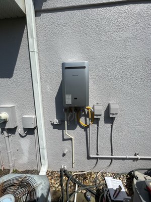 Tankless water heater change out - It was time to replace the old gas tankless water heater. We arrived and removed the old water heater, disconnected the gas, water piping and electric. We installed the new tankless water heater and mounted it to the wall. We also added a new flush kit so it can be maintained in the future.