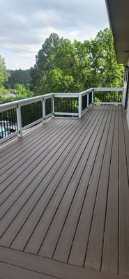 Deck Remodel - We transformed this aging backyard deck into a clean, modern space with fresh railing and trim. The updated design features crisp white framing with black metal balusters for a classic, durable finish. A simple but dramatic upgrade that brings new life to the home’s outdoor space. Deck Remodel - We transformed this aging backyard deck into a clean, modern space with fresh railing and trim. The updated design features crisp white framing with black metal balusters for a classic, durable finish. A simple but dramatic upgrade that brings new life to the home’s outdoor space.