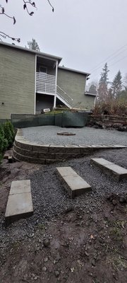 Retaining wall - Before and after of a Retaining wall, step, and gravel installation