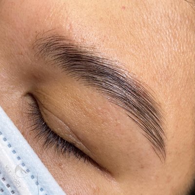 Brow Lamination + Wax - Brow Lamination helps tame unruly brows by treating the hair to change the direction of the hairs. Helps straighten curly hairs, lift downward growing hairs, and with this client helped straighten outward growing hairs and a cowlick. Results last up to 6 weeks. Brow Lamination + Wax - Brow Lamination helps tame unruly brows by treating the hair to change the direction of the hairs. Helps straighten curly hairs, lift downward growing hairs, and with this client helped straighten outward growing hairs and a cowlick. Results last up to 6 weeks.
