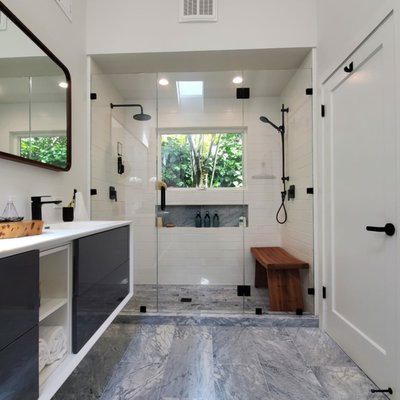 Bathroom Remodel - We gutted this old bathroom, vaulted the ceiling, added a skylight and framed a new window to increase the natural light. The shower room is the crowning jewel in this bathroom, with dual sprayers, custom bench, shampoo shelf and recessed lighting. Bathroom Remodel - We gutted this old bathroom, vaulted the ceiling, added a skylight and framed a new window to increase the natural light. The shower room is the crowning jewel in this bathroom, with dual sprayers, custom bench, shampoo shelf and recessed lighting.