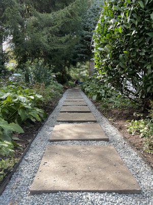 Blue Stone Walkway - What your viewing was once a dirt path with weeds and overgrown brush. We took that and crafted this beautiful bluestone walkway to easily travel from the front yard to the backyard.