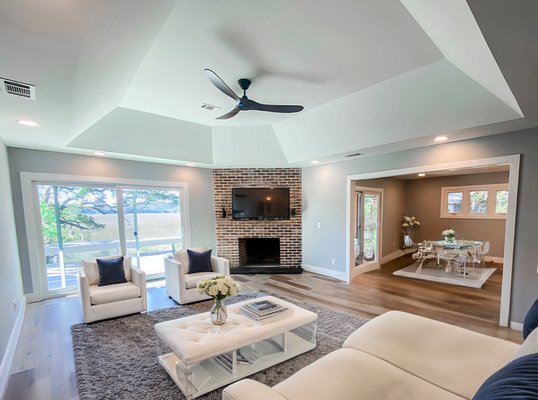 Hilton Head Plantation Full Remodel - This renovation project is a showcase of intentional design and thoughtful craftsmanship. By reimagining key areas of the home—including the kitchen, bathrooms, and the addition of a new powder room—our team created a space that offers both functionality and refined style. The goal was to enhance everyday living while incorporating timeless finishes, smart layouts, and modern amenities. From opening up the kitchen to expanding the master bath and optimizing underutilized spaces, every update was made with comfort, flow, and livability in mind. Warm tones, luxury materials, and cohesive detailing bring the entire home together, creating a welcoming and practical coastal retreat.

Project Key Features:
*Open-Concept Kitchen: Wall removed between kitchen and dining for improved flow; new cabinetry, countertops, LVP flooring, and updated electrical throughout.
*Kitchen Island Redesign: Expanded for function and style with reconfigured layout and added pantry cabinetry.
*Master Bathroom Expansion: Enlarged into closet space to accommodate a double vanity, walk-in tiled shower, new flooring, and reconfigured closet access.
*Hall Bathroom Upgrade: New vanity, walk-in tiled shower with glass door, updated tile flooring, and complete repainting.
*New Powder Room Addition: Elegant half-bath added near laundry area with new fixtures, LVP flooring, and full paint refresh.
*Modern Finishes Throughout: Luxury Vinyl Plank (LVP) flooring, cohesive color palette, and upgraded lighting and electrical for a fresh, modern look.


The Solution
This project brings together design-forward thinking and practical innovation to transform the kitchen, bathrooms, and laundry-adjacent areas into cohesive, modern spaces. From reconfiguring the layout to maximizing storage and enhancing finishes, every detail of this remodel was carefully considered to elevate functionality, optimize flow, and deliver a refined yet comfortable living experience. The kitchen renovation focused on a complete layout transformation to enhance both function and flow. We removed the existing wall between the kitchen and dining area, creating an open-concept space centered around a newly designed island that added versatility and visual appeal. All existing cabinetry and countertops were replaced, and the flooring was upgraded to luxury vinyl plank (LVP) with added ceramic tile accents for durability and style. The entire space was repainted, including walls, trim, and ceilings, creating a clean, cohesive finish. We also redesigned the refrigerator and pantry area with modern pantry cabinetry to optimize storage and elevate the kitchen’s aesthetic. All electrical components—outlets, switches, and lighting—were updated to support the new layout and appliances. In the master bathroom, we expanded into the existing closet to make room for a double vanity, a walk-in tiled shower, and a new toilet. Updated tile flooring and a reconfigured closet entrance enhanced both comfort and storage in the master suite. The hallway bathroom received a full update with a new vanity, tiled walk-in shower with a glass door, modern toilet, new tile flooring, and fresh paint. Electrical updates were also made throughout the space to meet current safety and design standards. A brand-new powder room was added adjacent to the laundry area, featuring LVP flooring, a new vanity and toilet, updated lighting, and a complete repaint for a polished, inviting look. Every element of this project was executed with attention to detail and craftsmanship, delivering a transformation that blended style, practicality, and elevated everyday living.