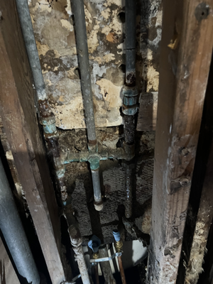 Bathroom Leak - We found a leak behind the bathroom wall. We replaced the shower faucet and ran a new copper pipe to stop the leak. Bathroom Leak - We found a leak behind the bathroom wall. We replaced the shower faucet and ran a new copper pipe to stop the leak.