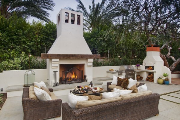 Custom Outdoor Kitchen & Concrete Patio in South Pasadena - Complete custom outdoor living project in South Pasadena featuring a built-in outdoor kitchen, wood-burning fireplace, pizza oven, custom concrete countertops, integrated concrete bench seating, sand-finish concrete patio, decorative stepping pavers, concrete driveway, CMU block walls, Saltillo tile patio, and a custom fountain. Concrete Etc. specializes in luxury outdoor living spaces, concrete patios, driveways, retaining walls, masonry, decorative concrete, and custom hardscape throughout South Pasadena, Pasadena, Los Angeles, the San Fernando Valley, and Santa Clarita. Serving homeowners with quality craftsmanship since 2007.