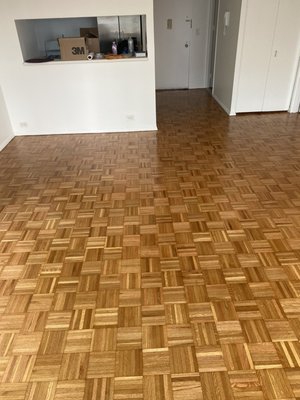 Parquet floor refinish. - The parquet floor was very worn and in need of a full restoration. We sanded the floors doing multiple passes until smooth. Stained golden oak and finished with a satin water based polyurethane.