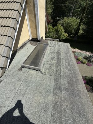Flat torch down roof. Two ply system. - This was an old flat torch down roof that was past its service life. We went ahead and installed a new two ply system to the clients home. In the process we also made the skylights to a higher curb mount height. Plus of course adding new gutters to a system that did not have them before. Water leaving a roof over the eaves can eventually rot out the fascia’s and the surrounding foundation below. So it is important that water from the roof has proper drainage solution.
