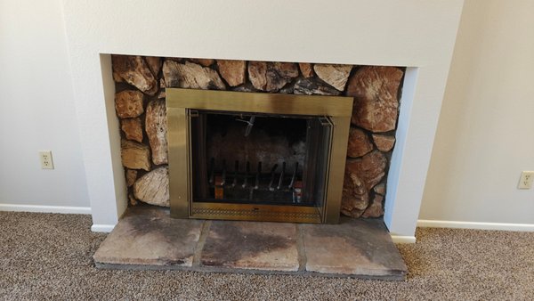 Fireplace Repair (Rampart) - The fireplace exhibited significant exterior and interior cracks, posing a potential fire hazard. It was a cast-in-place Rampart fireplace known for its known issues. As an alternative to demolition, we proposed a more cost-effective solution: repointing, sealing, and repairing the cracks, followed by repainting the chimney and installing the electric unit.