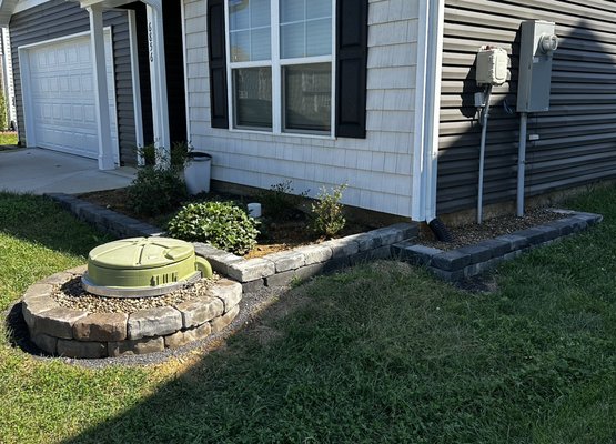 Retaining Wall - This custom retaining wall was installed to create clean, defined flower beds while adding structure and dimension to the home’s exterior. Retaining Wall - This custom retaining wall was installed to create clean, defined flower beds while adding structure and dimension to the home’s exterior.