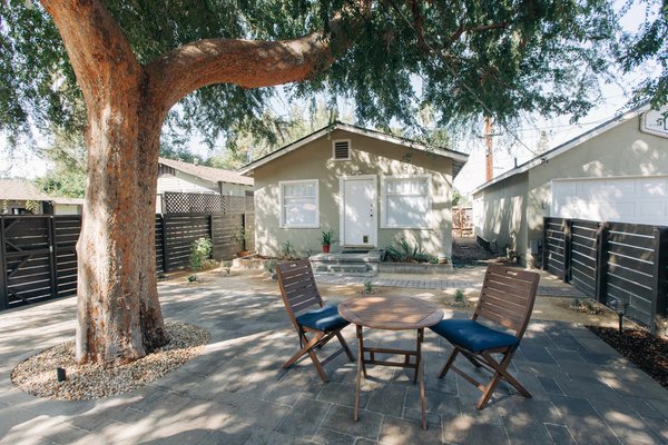 From Dirt to Delight: Transforming a South Pasadena Backyard - A Space Designed for Connection The vision was simple: create a space that felt dust-free, safe, welcoming, fresh, and comfortable. The homeowner wanted a balance of function and beauty — a dining area, a dance floor, and an open area where guests could lay out picnic blankets and enjoy the sunshine. Accented with native flowering plants and warm lights hanging from their beloved tree. An area for gardening and a water feature enhanced the space adding interest and calming sounds.