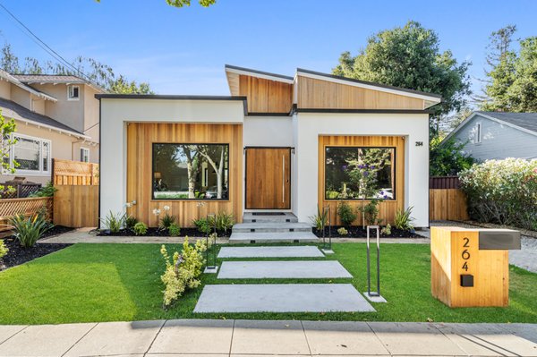 Palo Alto Modern - 264 Oxford Ave. Palo Alto 94303 - Stunning Palo Alto modern masterpiece in prime Evergreen Park. This 4/3 home features a variety of amenities within its breathtaking interior. Enter through its spectacular pivot door into a dramatic open floor plan. Plenty of natural light seamlessly unifies every room. A breathtaking fireplace design that stuns from every angle defined w/ Porcelanosa tile that spans the entire 18ft high wall. Soaring ceiling heights allow ample room to breathe. Gourmet kitchen w/custom modern cabinetry, built-in refrigerator, wine rm, a lavish/expansive kitchen island, waterfall in Calacatta marble. Finally, a built-in Miele appliance package guaranteed to satisfy the most demanding chef. The kitchen opens to dining & living areas. Custom stone tile/marble highlight the baths & the Idyllic master suite boasts patio access. Other amenities include laundry, basement cellar, smart home w/ modern tech. Top schools: Escondido, Green, Paly, Steps to Cal Ave. walk to schools, shops, parks & restaurants.