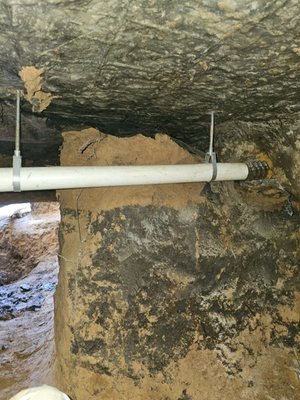 Bathroom Tunnel and Sewer Repair - This tunnel job was done because the old caste iron piping under the slab was rusted out and broken in several places. We dug out the old pipe under the slab and replaced it with new PVC pipe and DWV fittings. It was secured to the bottom of the slab with hangers and straps to make sure it had the slope it needed to drain properly. The dirt was packed back under the slab. In some areas concrete piers were set to support the slab from settling and breaking the pipe again in the future. All work is guaranteed against breaks and stoppages. All plumbing repairs are performed by licensed plumbers and a team of professional excavators hand dig and backfill the tunnels.