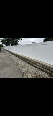 Retaining wall remodel - We took an all retaining wall, and the fence pushed the two retaining walls together to make a 4 foot fence with the retaining wall built around the posts Retaining wall remodel - We took an all retaining wall, and the fence pushed the two retaining walls together to make a 4 foot fence with the retaining wall built around the posts