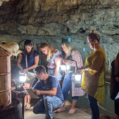 Escape Room - Stark Caverns is proud to offer the nation’s only in-cave Escape Room! Family legend says that Great Grandpappy made a fortune selling moonshine before he disappeared. You are all the family that he has left, and you’ve never seen anything to indicate this is true, until……. A letter has arrived from the far-off tropics. Great Grandpappy has left you the secret to his success, the family recipe and tickets to the tropical location where it is legal to make moonshine. Never much of a trusting man, he didn’t write the recipe down, but left clues hidden inside Stark Caverns where he used to make his ‘shine. Now you have 60 minutes to find the clues, solve the puzzles, and locate the recipe before the “revenuers” arrive. Escape Room - Stark Caverns is proud to offer the nation’s only in-cave Escape Room! Family legend says that Great Grandpappy made a fortune selling moonshine before he disappeared. You are all the family that he has left, and you’ve never seen anything to indicate this is true, until……. A letter has arrived from the far-off tropics. Great Grandpappy has left you the secret to his success, the family recipe and tickets to the tropical location where it is legal to make moonshine. Never much of a trusting man, he didn’t write the recipe down, but left clues hidden inside Stark Caverns where he used to make his ‘shine. Now you have 60 minutes to find the clues, solve the puzzles, and locate the recipe before the “revenuers” arrive.