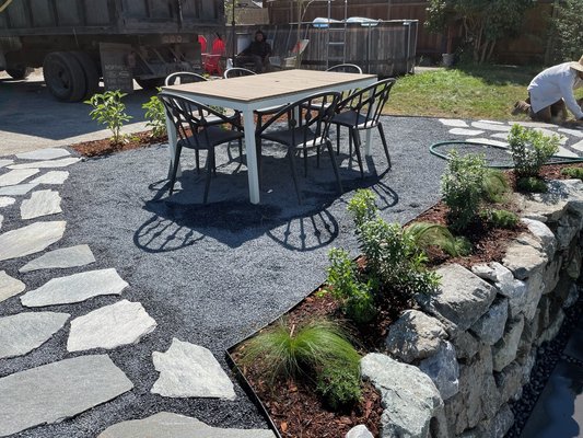 South Park - $60,000 - Our team uses grading and sloping to shape the terrain. This prepares the area for landscaping and promotes healthy soil drainage. We installed a variety of hardscaping projects, including a walkway, a stone staircase, and a retaining wall leading down to a sunken patio.
Using hardscaping for a multi-layer design helps keep soil in place, preventing erosion over time. The custom patio creates the perfect space for relaxing and entertaining. Stone hardscaping projects retain their original appearance with minimal maintenance over time. South Park - $60,000 - Our team uses grading and sloping to shape the terrain. This prepares the area for landscaping and promotes healthy soil drainage. We installed a variety of hardscaping projects, including a walkway, a stone staircase, and a retaining wall leading down to a sunken patio.
Using hardscaping for a multi-layer design helps keep soil in place, preventing erosion over time. The custom patio creates the perfect space for relaxing and entertaining. Stone hardscaping projects retain their original appearance with minimal maintenance over time.
