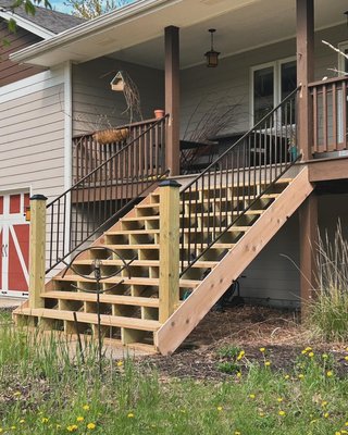 Outdoor Staircase - I got a call from a customer saying her stairs were rotting and falling apart, upon showing up I realized they weren’t safe to walk on anymore. I installed this new staircase shortly after. Cedar 2x6 for the tread, railings are 8’ bronze aluminum from menards. Outdoor Staircase - I got a call from a customer saying her stairs were rotting and falling apart, upon showing up I realized they weren’t safe to walk on anymore. I installed this new staircase shortly after. Cedar 2x6 for the tread, railings are 8’ bronze aluminum from menards.