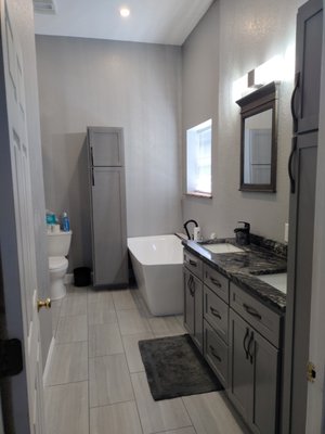 Bathroom remodel - This is a complete bathroom remodel. We gutted out the old and updated with custom cabinets, a walk-in shower, and new flooring, and paint. Bathroom remodel - This is a complete bathroom remodel. We gutted out the old and updated with custom cabinets, a walk-in shower, and new flooring, and paint.