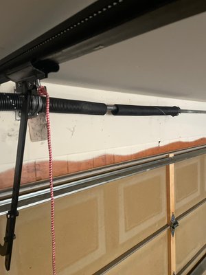 Garage Door Broken Spring - Replaced a heavy duty spring with a brand new one. Garage Door Broken Spring - Replaced a heavy duty spring with a brand new one.