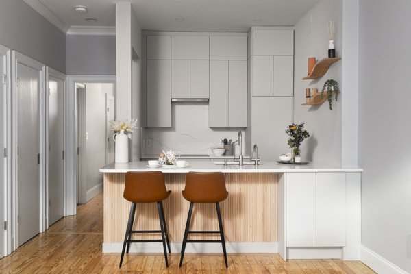 Boston Kitchen Remodel - This project features an interior renovation to the kitchen of a one-bedroom condo unit. The kitchen was transformed into a modern-style space with sleek countertops, advanced appliances, and ample storage, perfect for both functionality and aesthetics. Its open layout promotes socializing, making it the perfect spot for hosting. The final design features a mix of some the well preserved existing elements as well as some influences from modern Japanese design. Boston Kitchen Remodel - This project features an interior renovation to the kitchen of a one-bedroom condo unit. The kitchen was transformed into a modern-style space with sleek countertops, advanced appliances, and ample storage, perfect for both functionality and aesthetics. Its open layout promotes socializing, making it the perfect spot for hosting. The final design features a mix of some the well preserved existing elements as well as some influences from modern Japanese design.