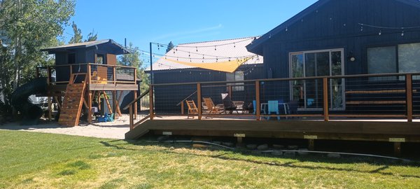 Backyard - We transformed this backyard with a new deck, hot tub, paver patio, and a playhouse for the kids complete with 12" of play sand. Backyard - We transformed this backyard with a new deck, hot tub, paver patio, and a playhouse for the kids complete with 12" of play sand.