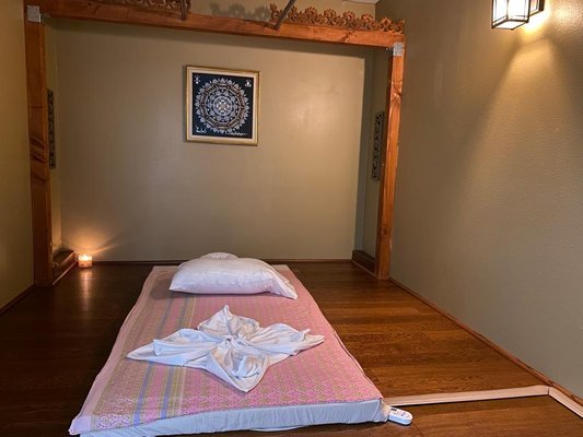 Thai Stretching and Massage - The stretching movements in Thai Yoga Massage affect the recipient’s entire body by improving flexibility, releasing both superficial and deep muscular tension, and deep relaxation with quieting of the mind. The effect of the stretching is similar to yoga. This is sometimes referred to as passive yoga, or “lazy person’s yoga” since the client plays only a passive role. The result leaves the recipient feeling both relaxed and energized at the same time." Thai massage has emotional and physical healing properties and its benefits include: Release of superficial and deep muscular tension, Pain relief, Increased flexibility, which in turn improves range of motion, Quieting of the mind, Deep relaxation. Thai Stretching and Massage - The stretching movements in Thai Yoga Massage affect the recipient’s entire body by improving flexibility, releasing both superficial and deep muscular tension, and deep relaxation with quieting of the mind. The effect of the stretching is similar to yoga. This is sometimes referred to as passive yoga, or “lazy person’s yoga” since the client plays only a passive role. The result leaves the recipient feeling both relaxed and energized at the same time." Thai massage has emotional and physical healing properties and its benefits include: Release of superficial and deep muscular tension, Pain relief, Increased flexibility, which in turn improves range of motion, Quieting of the mind, Deep relaxation.