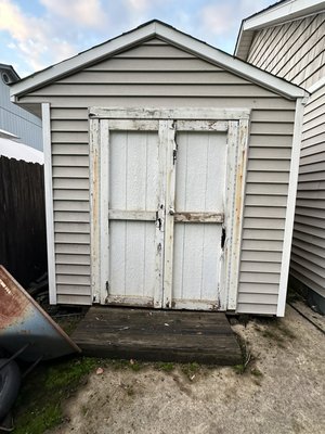 Refreshed Shed - doors, step, powerwash. - This homeowner needed a 20 year old set of shed doors replaced.  I built new doors and step, added fresh hardware, then finally power washed it all to freshen it up for the next 20 years.