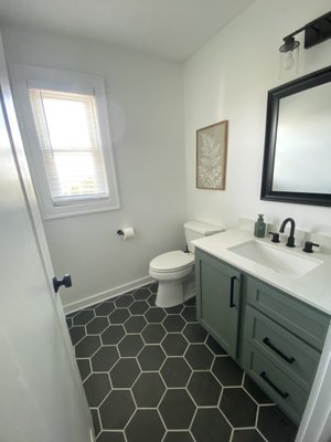 Bathroom Remodel - Original 80's bathroom with laminate floors and builder grade trim. Updated the vanity, tile floor, trim and bathroom hardware. Bathroom Remodel - Original 80's bathroom with laminate floors and builder grade trim. Updated the vanity, tile floor, trim and bathroom hardware.