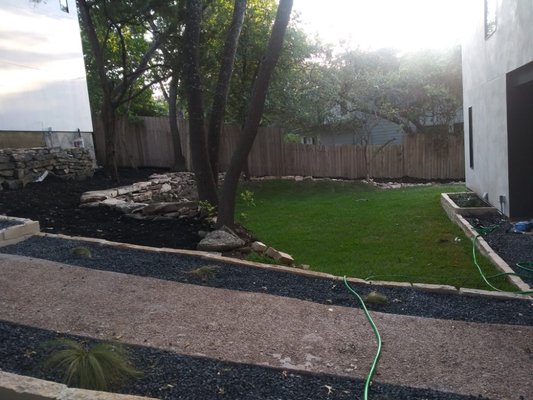 landscaping project - we re-do all front and back yard, we clean up the we built a flowerbeds, installation of new sod built a retaining wall