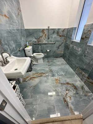Bathroom floor repair at law firm - Removed tiles were incorrect existing thin set on the floor was and corrected it Bathroom floor repair at law firm - Removed tiles were incorrect existing thin set on the floor was and corrected it