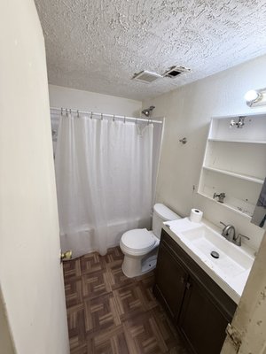 Bathroom update on a Budget - Old, run down bathroom needed TLC.  Customer had purchased a vanity that needed to be installed but on assessment the bathroom was in no condition to just assemble, replace and instal a new vanity.  Floors were old weather and falling apart, walls had holes and needed patch work and paint,  all bathroom hard wear needed replacing.  The exhaust fan was original fan, never cleaned and broken down.  Shower head was corroded, had no power and was rusting.  After full assessment the customer trusted me to go in and do what needed to be done to re do his bathroom on his budget.