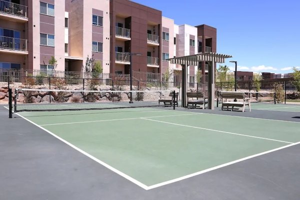 amenities area - Luxury apartment complex amenities area. pool, pickleball court, steel/ stone pergola, gas fire pit and BBQ area, amenities area - Luxury apartment complex amenities area. pool, pickleball court, steel/ stone pergola, gas fire pit and BBQ area,