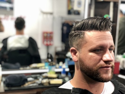Haircut and beard trim and line up service. - This is a clean beard trim with lineup as well as classic pomp with a low taper by old time J. If you are looking for a new look for the new year we are your shop! Come see any of our awesome barbers! We are even open on sunday! Haircut and beard trim and line up service. - This is a clean beard trim with lineup as well as classic pomp with a low taper by old time J. If you are looking for a new look for the new year we are your shop! Come see any of our awesome barbers! We are even open on sunday!