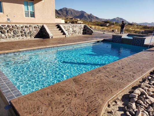 Eichinger Custom Pool - Custom pool, retaining walls, wrought iron railing, and stamped concrete Decking Eichinger Custom Pool - Custom pool, retaining walls, wrought iron railing, and stamped concrete Decking