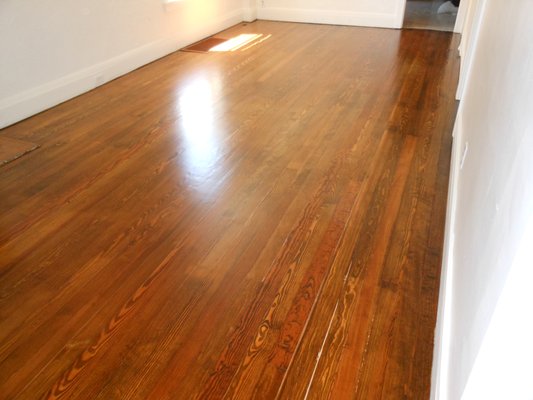 140 Year Old Pine Floors - These floors were as old as the house and turned out great after they were refinished.  Even a soft wood like pine can last a long time with a little bit of care.