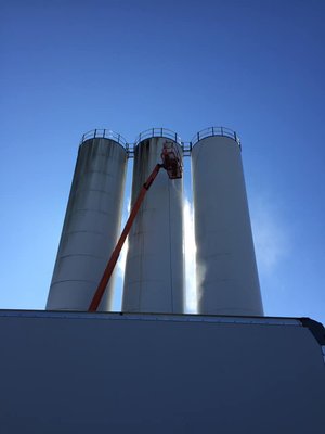 Commercial Pressure Washing & Painting Project - Primex Oakwood, GA - RPS completed this Commercial Pressure Washing & Painting Project for Primex Plastics in Oakwood, GA! They are such a great company and fun group of people. We thoroughly enjoyed working with them on completing this curb appeal refresher! We pressure washed the entire building, surrounding walkways and silos, prior to applying a fresh coat of white and blue paint. Everything turned out excellent! Contact RPS for a free quote today.