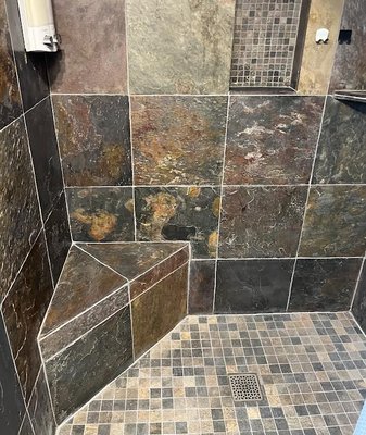 Shower Restoration - This was a natural stone slate shower in dire need of some TLC. This shower was thoroughly cleaned with the appropriate solution, perimeters were removed and repaired, as well as color sealing all of the grout joints on the walls and floor. The result is a brand new looking shower. Shower Restoration - This was a natural stone slate shower in dire need of some TLC. This shower was thoroughly cleaned with the appropriate solution, perimeters were removed and repaired, as well as color sealing all of the grout joints on the walls and floor. The result is a brand new looking shower.