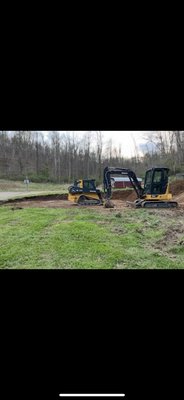 Excavation project 2025 - This was fun little job. Had to remove trees, remove dirt and install 4 inch perforated corrugated pipe & drainage stone around house seat. Excavation project 2025 - This was fun little job. Had to remove trees, remove dirt and install 4 inch perforated corrugated pipe & drainage stone around house seat.