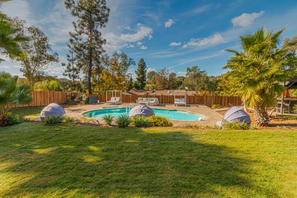 Full backyard remodel El Cajon. - Transforming outdoor spaces into stunning retreats, this portfolio highlights our craftsmanship and attention to detail. A custom water feature with stacked stone walls and cascading waterfalls adds elegance and serenity. Outdated pool decks were replaced with sleek paver patios, modern lounge furniture, and vibrant landscaping for a resort-like vibe. Synthetic grass was installed in front and backyards for a lush, low-maintenance look. Paver walkways, multi-level steps, and updated patios connect spaces seamlessly while blending style and functionality. Each project showcases a perfect balance of beauty and practicality, designed to inspire and impress. Full backyard remodel El Cajon. - Transforming outdoor spaces into stunning retreats, this portfolio highlights our craftsmanship and attention to detail. A custom water feature with stacked stone walls and cascading waterfalls adds elegance and serenity. Outdated pool decks were replaced with sleek paver patios, modern lounge furniture, and vibrant landscaping for a resort-like vibe. Synthetic grass was installed in front and backyards for a lush, low-maintenance look. Paver walkways, multi-level steps, and updated patios connect spaces seamlessly while blending style and functionality. Each project showcases a perfect balance of beauty and practicality, designed to inspire and impress.