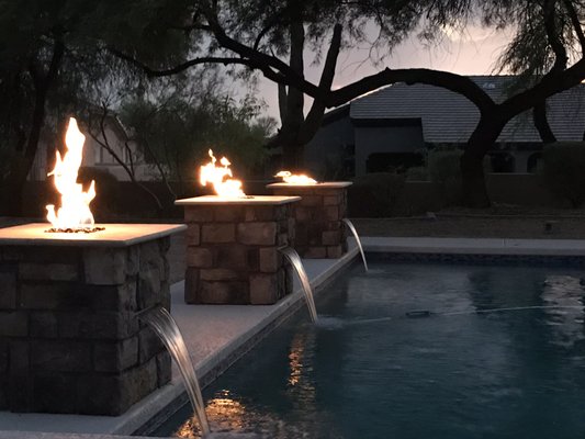 Pool Remodel and Water Features in Scottsdale 2019 - This remodel was a fun project in where we turned an old tired pool into a backyard feature. Everything needed updating and repair, from tile to pool surface, the cool decking and concrete around the pool, and new water features with gas and water ran to three locations.