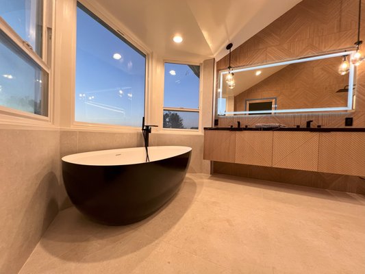 Bathroom Remodeling in Sherman Oaks, CA - This stunning bathroom remodel in Sherman Oaks, CA, combines luxury and practicality with a sleek, modern design. The space features a spacious walk-in shower with elegant tile work, a freestanding soaking tub for ultimate relaxation, and a double vanity with ample storage and stylish finishes. The contemporary fixtures, sophisticated lighting, and open layout create a serene, spa-like atmosphere. This remodel elevates both the style and functionality of the home, adding lasting value. Bathroom Remodeling in Sherman Oaks, CA - This stunning bathroom remodel in Sherman Oaks, CA, combines luxury and practicality with a sleek, modern design. The space features a spacious walk-in shower with elegant tile work, a freestanding soaking tub for ultimate relaxation, and a double vanity with ample storage and stylish finishes. The contemporary fixtures, sophisticated lighting, and open layout create a serene, spa-like atmosphere. This remodel elevates both the style and functionality of the home, adding lasting value.
