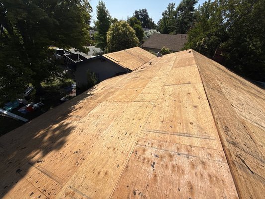 Full Re-roof with Flat Roof Component - At this property, two roof planes intersected without a proper slope or valley, resulting in chronic water pooling and an increased risk of leaks. To resolve the issue, our team fabricated and installed a custom cricket to redirect water away from the flat intersection point. We then applied a fully adhered TPO membrane over the area, providing a watertight, durable surface with enhanced drainage. This upgrade not only improves long-term performance but also protects the structural integrity of the roof. Full Re-roof with Flat Roof Component - At this property, two roof planes intersected without a proper slope or valley, resulting in chronic water pooling and an increased risk of leaks. To resolve the issue, our team fabricated and installed a custom cricket to redirect water away from the flat intersection point. We then applied a fully adhered TPO membrane over the area, providing a watertight, durable surface with enhanced drainage. This upgrade not only improves long-term performance but also protects the structural integrity of the roof.