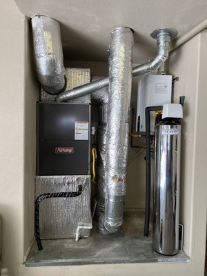 Plumbing and HVAC Upgrade - This plumbing and HVAC upgrade includes a Navien tankless water heater, HALO Whole House Water Filtration System, new Air Temp furnace and new Air Temp AC unit.  This customer will be enjoying the benefits of an energy efficient tankless water heater with a plentiful supply of hot water while the HALO House Water Filtration System adds the ease of mind knowing their water is safe from heavy metals and chlorine.  This HVAC upgrade will keep our customer warm in the winter and cool in the summer! No need to worry about the furnace going out during our cold, snowy months.  These plumbing and HVAC upgrades will allow our customer to enjoy all of the comforts of home.