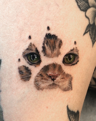 Pet Portrait - Vism Studio's pet portrait tattoos are heartfelt tributes, capturing the essence of beloved companions through delicate fine-line work and thoughtful composition. Each piece transforms cherished memories into lasting art, blending realism with emotional depth.