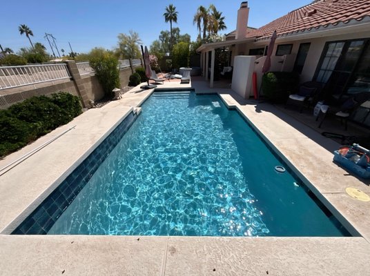 Residential Lap Pool Weekly Cleaning & Maintenance - This project showcases ongoing weekly pool cleaning and maintenance service for a residential lap pool. Lap pools require consistent attention to water chemistry and circulation to keep the water clear and safe, especially with high evaporation rates and dust exposure. Our team maintains this pool on a regular schedule — brushing walls and steps, vacuuming the floor, emptying baskets, testing and adjusting chemicals, and inspecting equipment at every visit. The result speaks for itself: crystal clear, vibrant blue water that is balanced, sanitized, and swim-ready every week. Whether you swim daily or just want your backyard to look its best, regular professional maintenance is the key to a pool you can always be proud of. Residential Lap Pool Weekly Cleaning & Maintenance - This project showcases ongoing weekly pool cleaning and maintenance service for a residential lap pool. Lap pools require consistent attention to water chemistry and circulation to keep the water clear and safe, especially with high evaporation rates and dust exposure. Our team maintains this pool on a regular schedule — brushing walls and steps, vacuuming the floor, emptying baskets, testing and adjusting chemicals, and inspecting equipment at every visit. The result speaks for itself: crystal clear, vibrant blue water that is balanced, sanitized, and swim-ready every week. Whether you swim daily or just want your backyard to look its best, regular professional maintenance is the key to a pool you can always be proud of.