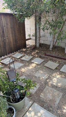 Paver and Garden Repair - This side yard and garden had just been put together to have it looking nice for guests. Then a pipe burst and the plumbers on the job had to dig up the pavers to fix the leak. Unfortunately they didn’t reset the pavers and even broke a few in the process. And a whole row of them were covered and dirt and no longer visible. So I cleaned everything up, reset all pavers, cleaned between each one to lay new pea pebbles to have it back in it’s original condition. Paver and Garden Repair - This side yard and garden had just been put together to have it looking nice for guests. Then a pipe burst and the plumbers on the job had to dig up the pavers to fix the leak. Unfortunately they didn’t reset the pavers and even broke a few in the process. And a whole row of them were covered and dirt and no longer visible. So I cleaned everything up, reset all pavers, cleaned between each one to lay new pea pebbles to have it back in it’s original condition.