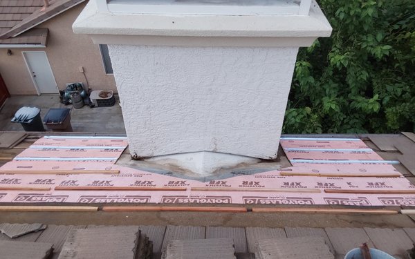 Roof Leak repair at Chimney - This customer had a roof leak at the chimney area caused from debris clogging the flashing. This can all be avoided with proper maintenance on tile roofs. We install new high temperature ice and water shield (required for tile roofs) and reshaped and cleaned the flashing around the chimney Roof Leak repair at Chimney - This customer had a roof leak at the chimney area caused from debris clogging the flashing. This can all be avoided with proper maintenance on tile roofs. We install new high temperature ice and water shield (required for tile roofs) and reshaped and cleaned the flashing around the chimney